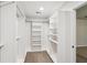 Spacious walk-in closet provides ample storage with built-in shelving and hanging rods at 4967 Zoya Sw Ct, Atlanta, GA 30331