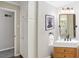 Well-lit bathroom with a rustic wood vanity, ample cabinet space, and modern fixtures at 860 Valleymeade Se Dr, Marietta, GA 30067