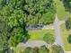 Aerial view of the home showcasing the well-maintained lawn and mature trees at 2173 Tanglewood Ne Trl, Conyers, GA 30013