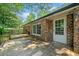 Charming backyard featuring a brick home, wooden deck and lush landscaping at 2173 Tanglewood Ne Trl, Conyers, GA 30013