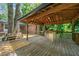 Wooden gazebo featuring a bar area, overhead lighting and scenic views at 2173 Tanglewood Ne Trl, Conyers, GA 30013