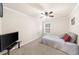 Simple bedroom with carpeting, ceiling fan, and ample natural light at 2685 Gateview Ct, Cumming, GA 30040