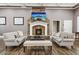 Inviting clubhouse featuring stone fireplace, comfortable sofas, and stylish decor at 2685 Gateview Ct, Cumming, GA 30040