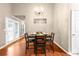 Dining room with a modern chandelier, seating for four and french doors to a patio at 2685 Gateview Ct, Cumming, GA 30040
