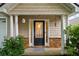 Inviting front entryway with decorative stone accents and a black door with sidelights at 2685 Gateview Ct, Cumming, GA 30040