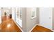 Hallway featuring hardwood floors and neutral walls, leading to other rooms at 2685 Gateview Ct, Cumming, GA 30040