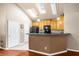 Bright kitchen with breakfast bar, ample cabinetry, and black appliances at 2685 Gateview Ct, Cumming, GA 30040