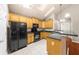 Bright kitchen featuring black appliances, light countertops, and white tile floors at 2685 Gateview Ct, Cumming, GA 30040