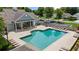 Community pool area with ample lounging, adjacent clubhouse, and parking, inviting residents at 2685 Gateview Ct, Cumming, GA 30040