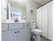 Neutral bathroom features a large mirror, a window, and tiled floors at 3018 Patriot Square, Marietta, GA 30064
