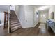 Spacious foyer with wood floors and natural light leading to the staircase at 3018 Patriot Square, Marietta, GA 30064