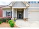 Inviting front entrance with stone accents, well manicured landscaping and a charming front door at 3018 Patriot Square, Marietta, GA 30064