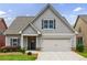 Charming home featuring neutral siding, a two-car garage, and a well-maintained front yard at 3018 Patriot Square, Marietta, GA 30064