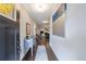 Warm and inviting hallway featuring wood floors, modern decor, and view to the living room at 3018 Patriot Square, Marietta, GA 30064