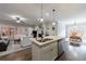 Open concept kitchen with stainless steel appliances and a center island open to the living and dining area at 3018 Patriot Square, Marietta, GA 30064