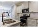 Gourmet kitchen with stainless steel appliances and granite countertops at 3018 Patriot Square, Marietta, GA 30064