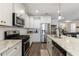 Bright kitchen with granite counters, modern appliances, and an open layout at 3018 Patriot Square, Marietta, GA 30064