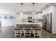 Modern kitchen featuring an island with seating, stainless steel appliances, and white cabinetry at 3018 Patriot Square, Marietta, GA 30064