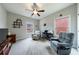 Spacious room features two windows, an overhead fan, two chairs, and a desk at 3018 Patriot Square, Marietta, GA 30064