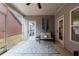 Cozy screened porch with comfortable seating and view of the yard at 3018 Patriot Square, Marietta, GA 30064