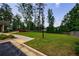 Well-maintained lawn with mature trees, landscaping, and a patio area perfect for outdoor enjoyment at 3018 Patriot Square, Marietta, GA 30064