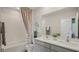 Modern bathroom showcasing a double vanity, shower/tub, and contemporary fixtures at 5451 Baybrook Cir, South Fulton, GA 30349