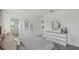 Light-filled primary bedroom with a dresser, stylish mirror, and modern decor at 5451 Baybrook Cir, South Fulton, GA 30349