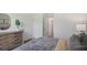 Comfortable bedroom setup with a modern dresser, soft carpeting, and serene lighting at 5451 Baybrook Cir, South Fulton, GA 30349