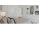 Cozy bedroom featuring a bed, framed art, and a decorative pillow arrangement at 5451 Baybrook Cir, South Fulton, GA 30349