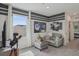A stylish bonus room with striped walls, comfortable seating, and a large window offering natural light at 5451 Baybrook Cir, South Fulton, GA 30349