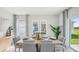 Bright dining room with modern decor, natural light, and sliding glass door access at 5451 Baybrook Cir, South Fulton, GA 30349
