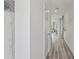 Bright hallway with neutral paint, light flooring, and a view into living area at 5451 Baybrook Cir, South Fulton, GA 30349