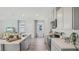 Bright, well-lit kitchen features stainless steel appliances, light gray cabinetry, and sleek countertops at 5451 Baybrook Cir, South Fulton, GA 30349