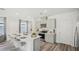 Modern kitchen features an island with seating, stainless steel appliances and ample storage at 5451 Baybrook Cir, South Fulton, GA 30349