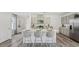 Open kitchen featuring a large island with bar seating, modern appliances, and ample counter space at 5451 Baybrook Cir, South Fulton, GA 30349