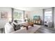 Bright living room with large windows, soft lighting, and stylish, modern furniture at 5451 Baybrook Cir, South Fulton, GA 30349