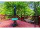 Relax on the spacious deck surrounded by mature trees offering privacy and shade at 210 Evans Dr, Decatur, GA 30030