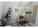 Clean bathroom featuring a toilet and shower with safety bars and natural light at 210 Evans Dr, Decatur, GA 30030