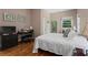 Spacious bedroom boasts wood floors, ample natural light, and a comfortable workspace at 210 Evans Dr, Decatur, GA 30030