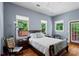 Bright bedroom with classic wood floors and refreshing natural light through white framed windows at 210 Evans Dr, Decatur, GA 30030