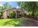 Charming single-story home with a well-maintained lawn and inviting front porch at 210 Evans Dr, Decatur, GA 30030