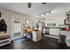 Charming kitchen with slate floors, white cabinets, stainless appliances and breakfast bar at 210 Evans Dr, Decatur, GA 30030