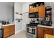 Well-organized kitchen with stainless steel appliances and wooden cabinetry at 210 Evans Dr, Decatur, GA 30030
