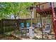 Relaxing outdoor patio with seating, outdoor heater and wooden fence at 210 Evans Dr, Decatur, GA 30030