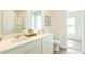 Bright bathroom featuring double sinks, a large mirror, and a glass-enclosed shower in the background at 5449 Baybrook Cir, South Fulton, GA 30349