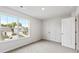 Bright bedroom with neutral carpet, large window, and double door closet at 5449 Baybrook Cir, South Fulton, GA 30349