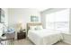Cozy bedroom with natural light, a comfortable bed, and a stylish nightstand with lamp at 5449 Baybrook Cir, South Fulton, GA 30349
