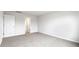 Bright and airy bedroom featuring neutral carpet, white walls, and a view into the hallway and other rooms at 5449 Baybrook Cir, South Fulton, GA 30349