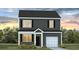 Charming two-story home featuring dark siding, white trim and a one car garage at 5449 Baybrook Cir, South Fulton, GA 30349
