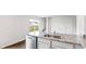 Open concept kitchen with granite countertops, stainless steel dishwasher, and plenty of natural light at 5449 Baybrook Cir, South Fulton, GA 30349